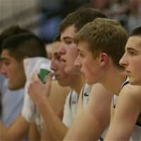 <p>The Byram Hills boys watch the action from the bench.</p>