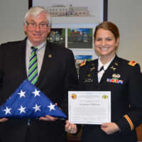<p>Mahwah Mayor Bill Laforet received an American flag that flew in Afghanistan from Danielle Ullman, a Mahwhah resident who serves in the U.S. Army.</p>