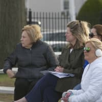 <p>Spectators take in the action on a chilly day at Port Chester.</p>