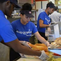 <p>Employees at a Jersey Mike&#x27;s Subs in Wayne prepare sandwiches during the &quot;Day of Giving&quot; campaign.</p>
