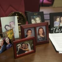 <p>Pictures of family sit on Gills desk at North Rockland High School.</p>