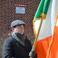 <p>Holding the Irish flag during the Irish national anthem, &quot;The Soldier&#x27;s Song.&quot;</p>