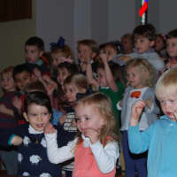 <p>Kids doing the chicken dance at the &quot;Thanksgiving Sing.&quot;</p>