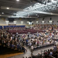 <p>Ossining High School held its annual commencement ceremony Saturday at Pace University, with a big crowd filling the school&#x27;s Health &amp; Fitness Center on on a hot, sunny afternoon.</p>