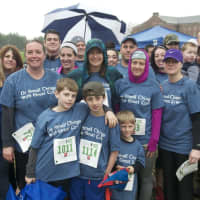 <p>More than 2,100 runners turn out in the rain to run in the Sandy Hook 5K in Newtown on Saturday.</p>