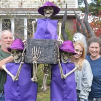 <p>Pete, Amber and Terry Tiernan stand on their Waldwick front yard.</p>