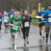 <p>Runners head toward the finish line at the Sandy Hook 5K.</p>