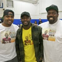 <p>From left: Michael Little-Redd, Silas Redd and Carver Teen Center manager Tremain Gilmore at Saturday&#x27;s clothing drive.</p>