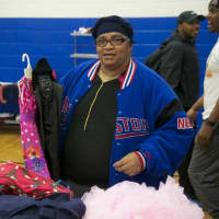 <p>A woman looks through clothing at Saturday&#x27;s Threads for the City Clothing Drive &amp; Swap.</p>