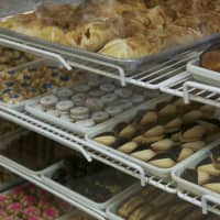 <p>The shelves are stocked with freshly baked cookies and pastries.</p>