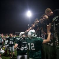 <p>Brewster players greet fans after the game.</p>