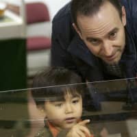 <p>A man and a young boy check out the trains at the Wilton Historical society.</p>