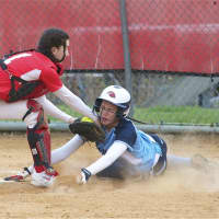 <p>Ursuline&#x27;s Korina Guerra is called out at the plate, as North Rockland catcher Bella Chiorazzi applies the tag.</p>