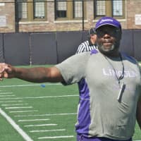 <p>Lincoln football coach Robert Bannister directs players at Saturday&#x27;s six-team scrimmage.</p>