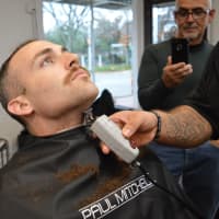 <p>Hillsdale Officer Corey Rooney, the newest member of the force, losing his beard.</p>