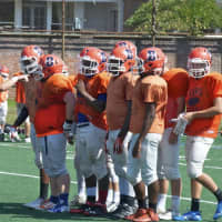 <p>Briarcliff players in huddle during scrimmage.</p>