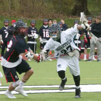 <p>Fox Lane held on for an 11-8 win Thursday at Pleasantville. Panthers captain Michael Hammond (27) looks to clear ball.</p>