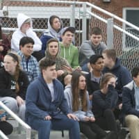 <p>Fans watch the game Thursday at Pleasantville.</p>