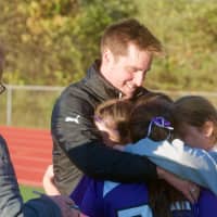 <p>John Jay coach Dave Nuttall embraces players after Friday&#x27;s playoff loss.</p>