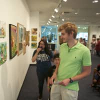<p>Visitors stroll through the UCONN Art Gallery during Friday night&#x27;s Artwalk.</p>