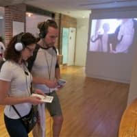 <p>Visitors check out the displays at Franklin Street Works during Friday night&#x27;s Artwalk.</p>