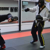 <p>Charlie DiGirolamo (right) spars with student Leonidas Tsiavos, 55, at Northern Valley Martial Arts in Norwood.</p>