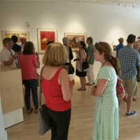 <p>Visitors mingle at the Faculty Art Exhibit at WCSU&#x27;s West Side Campus.</p>