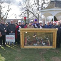 <p>A group gathers at the Monroe Town Green on Saturday for a Blessing of the Creche.</p>