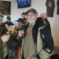 <p>Customers sample various brews on opening day.</p>