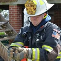 <p>River Edge Deputy Fire Chief James Rush with one of the rescues.</p>