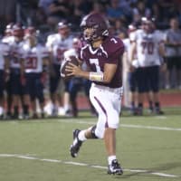 <p>Harrison QB Mike Nannariello looks downfield for a target in Friday&#x27;s loss to Eastchester.</p>