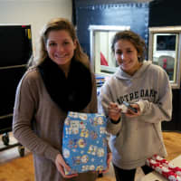 <p>Teens wrapping gifts for the Wrap Up fundraiser.</p>