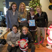 <p>Some of the teens working on the Wrap Up fundraiser pose for a group photo Saturday at The Depot in Darien.</p>