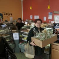 <p>A customer leaves Pastry Garden with a box full of goodies. </p>