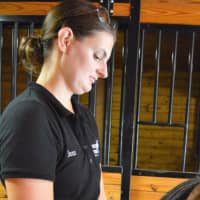 <p>A moment of communion for Jenn Ripston, instructor at Pony Power Therapies, with a horse.</p>