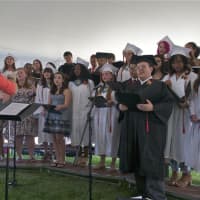 <p>Dover High School celebrated the Class of 2016 Saturday morning with a commencement ceremony under a large tent on the school&#x27;s athletic field. Here, the chorus performs for the crowd.</p>