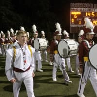 <p>The Harrison marching band comes on the field at Friday night&#x27;s season opener.</p>