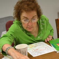 <p>Joan Endrigo, of Ramsey, at a session of Coffee and Coloring at the Oakland Public Library. She prefers coloring with gel pens because they have a little sparkle.</p>