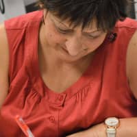 <p>Judy Manegold, of Pompton Lakes, shows her creative side during a session of Coffee and Coloring at Oakland Public Library.</p>