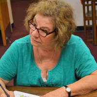 <p>Claire Salvador, of Oakland, colors and converses at a recent session of Coffee and Coloring at the Oakland Public Library.</p>