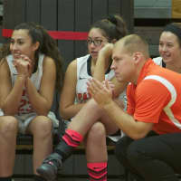<p>Pawling coach John Sullivan and the Tigers bench watch the action.</p>