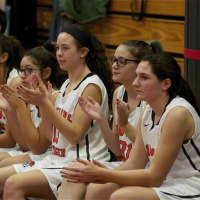 <p>The Pawling bench cheers teammates.</p>
