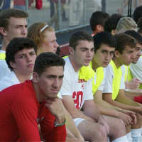 <p>Somers players watch the action from the sideline Wednesday at Lakeland High School.</p>