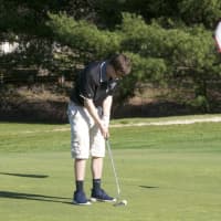 <p>Taking aim for a short putt at Whitney Farms.</p>
