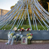 <p>Flowers, photos and other items were left by loved ones at the 9/11 memorial &#x27;The Rising&#x27; at Friday&#x27;s memorial ceremony. </p>