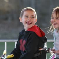 <p>Two happy youngsters enjoy one of the many kids rides at Trumbull&#x27;s Rotary Carnival.</p>