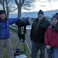 <p>Members of the Westport Astronomical Society get one of their telescopes ready for viewing the night sky.</p>