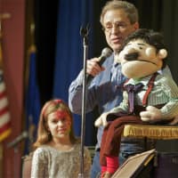 <p>A ventriloquist entertains at Saugatuck Elementary School.</p>