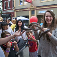 <p>A girl handles a boa constrictor at Saturday&#x27;s Taste of Danbury festival.</p>