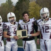 <p>Scarsdale captains pose with the Class AA runnerup plaque.</p>